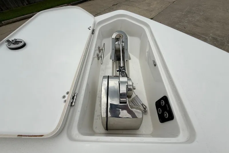 Slide: The Image of Anchor compartment of 2023 Key West 263 FS boat, featuring stainless steel hardware. - 27