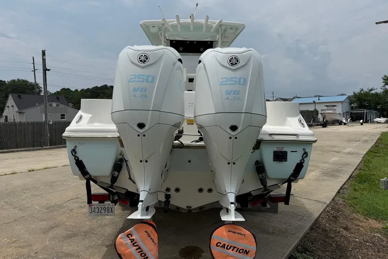 Slide: The Image of 2023 Key West 263 FS boat with twin Yamaha 250 V6 outboard engines. - 2
