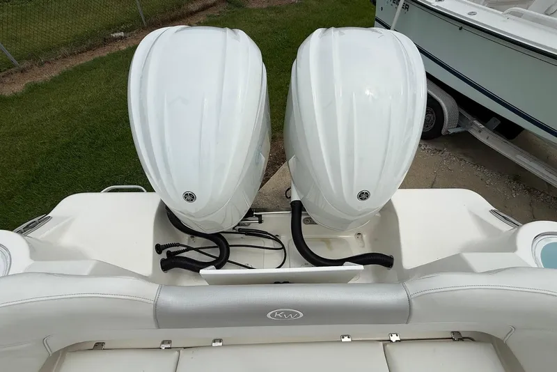 Slide: The Image of 2023 Key West 263 FS boat with dual outboard motors, viewed from above. - 6