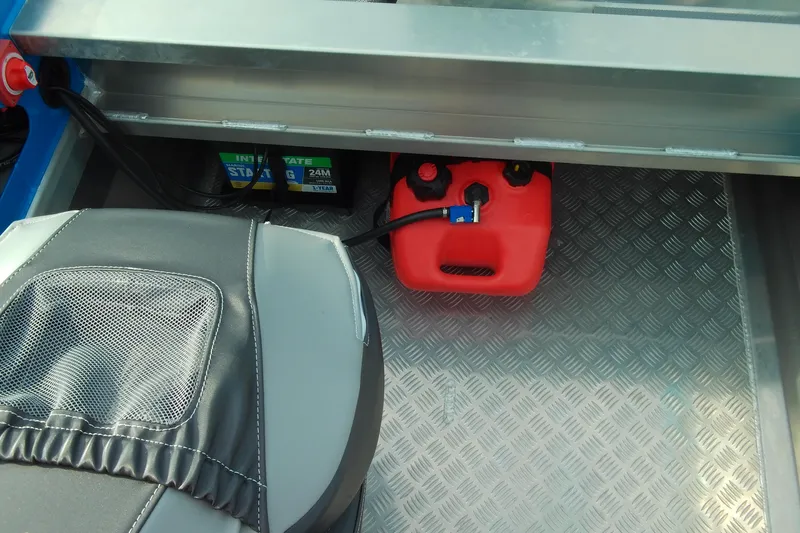 Slide: The Image of Stabicraft 1450 Frontier 2025 interior with battery and fuel tank setup. - 7