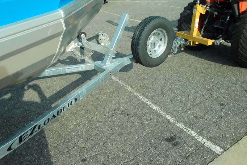 Slide: The Image of Trailer hitch of a 2025 Stabicraft 1450 Frontier boat on EZ Loader trailer. - 16