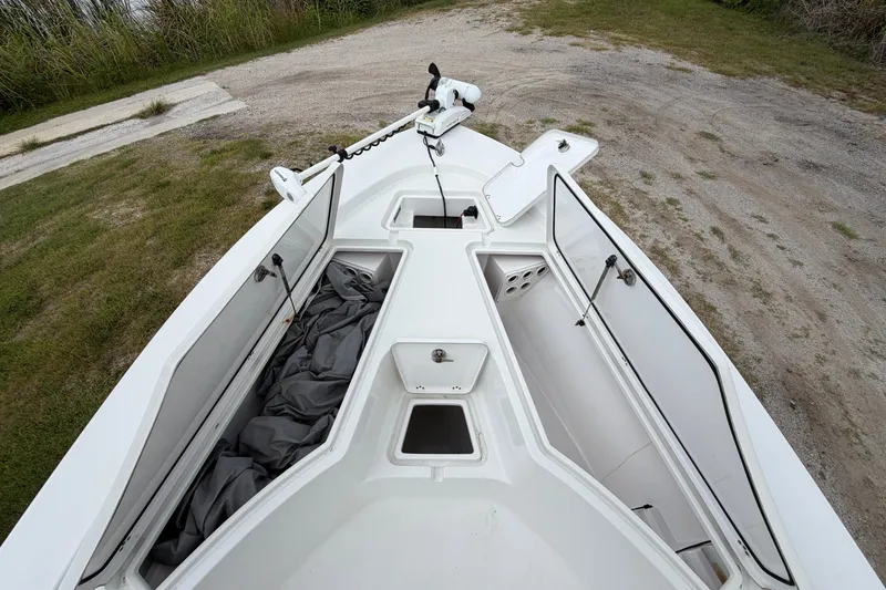 Slide: The Image of 2019 Sportsman Masters 227 Bay Boat with open storage compartments on deck. - 8