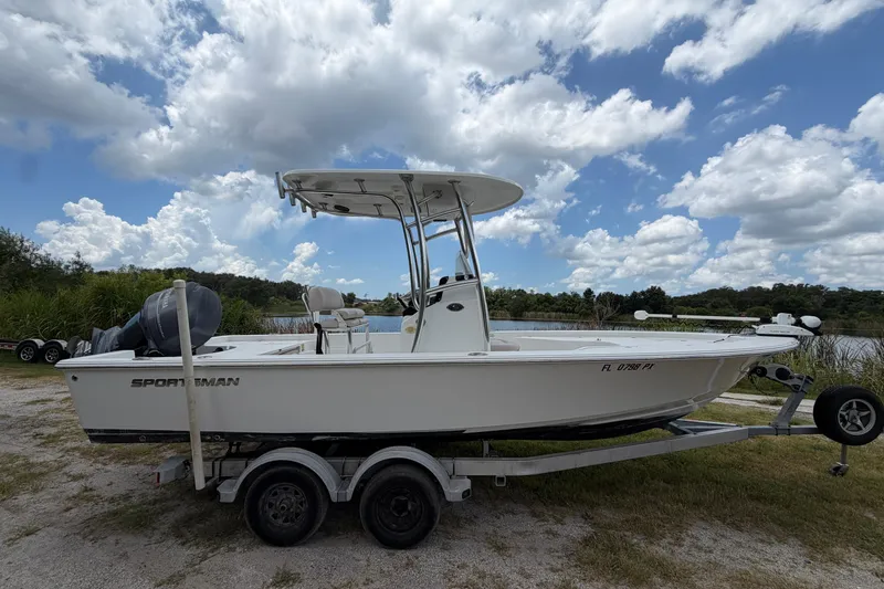 Slide: The Image of 2019 Sportsman Masters 227 Bay Boat on trailer under cloudy sky. - 3