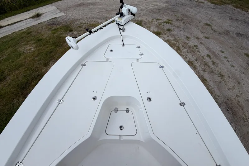 Slide: The Image of 2019 Sportsman Masters 227 Bay Boat deck with storage compartments and trolling motor. - 9