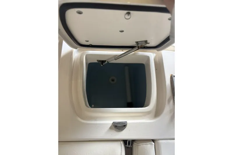 Slide: The Image of Open storage compartment on a 2015 Grady-White Freedom 275 boat. - 19