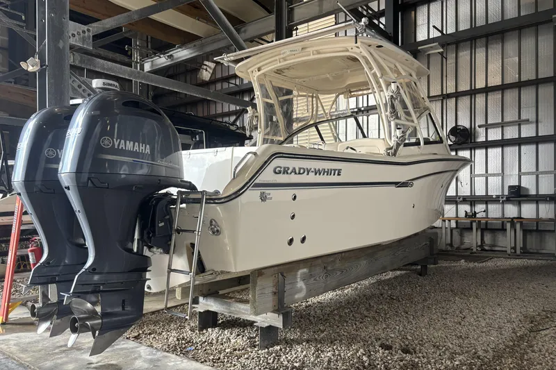 Slide: The Image of 2015 Grady-White Freedom 275 boat with Yamaha engines in storage facility. - 5