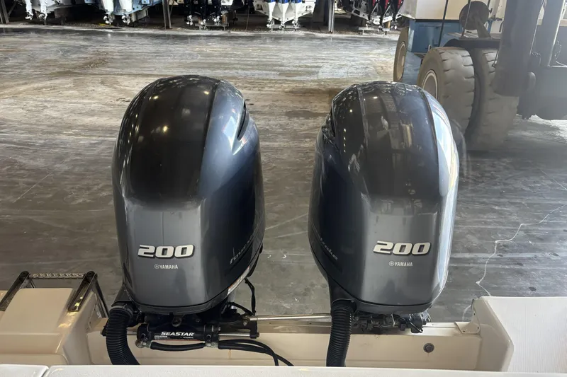 Slide: The Image of Twin Yamaha 200 outboard engines on a 2015 Grady-White Freedom 275 boat. - 7