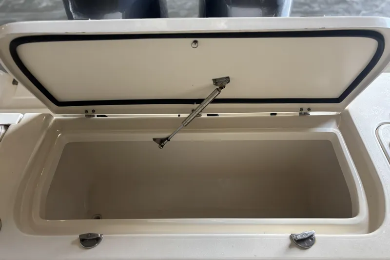 Slide: The Image of Open storage compartment on a 2015 Grady-White Freedom 275 boat. - 18