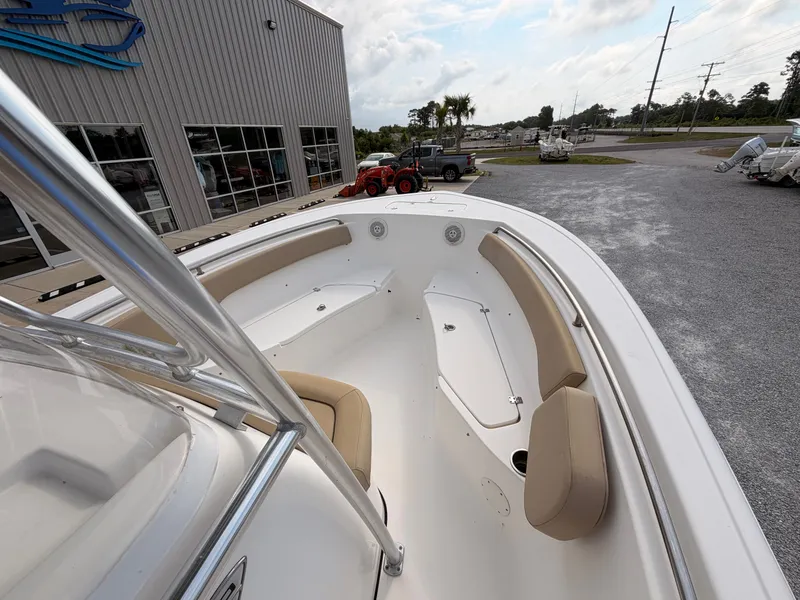 Slide: The Image of The image shows the bow area of a 2016 Tidewater 220 LXF boat with beige seating. - 10