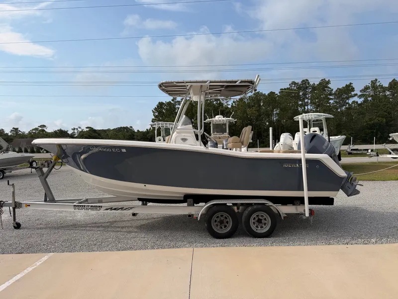 Slide: The Image of A 2016 Tidewater 220 LXF boat on a trailer in a parking area. - 5
