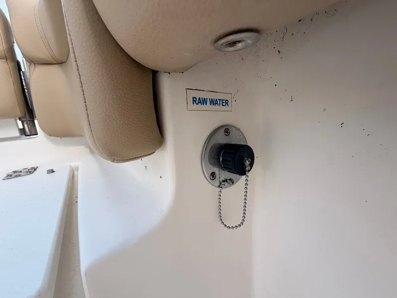 Slide: The Image of Close-up of a raw water connection on a boat with beige seating. - 16
