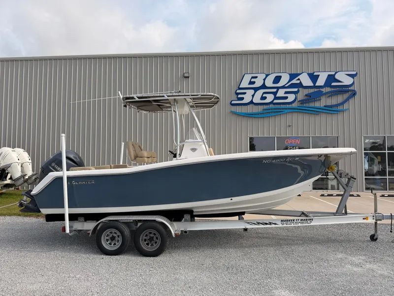 The Image of A 2016 Tidewater 220 LXF boat on a trailer in front of a building with a "Boats 365" sign. - 0