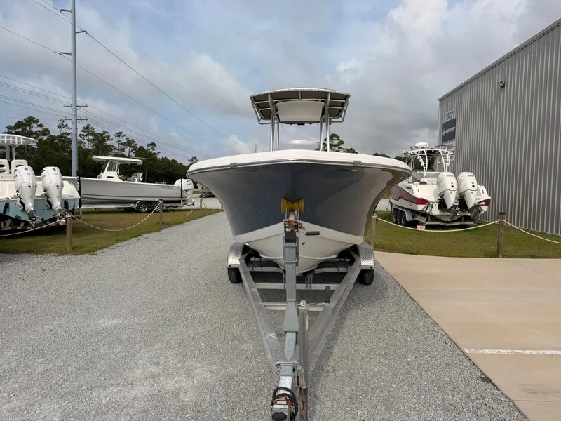 Slide: The Image of A 2016 Tidewater 220 LXF boat on a trailer in an outdoor area. - 7