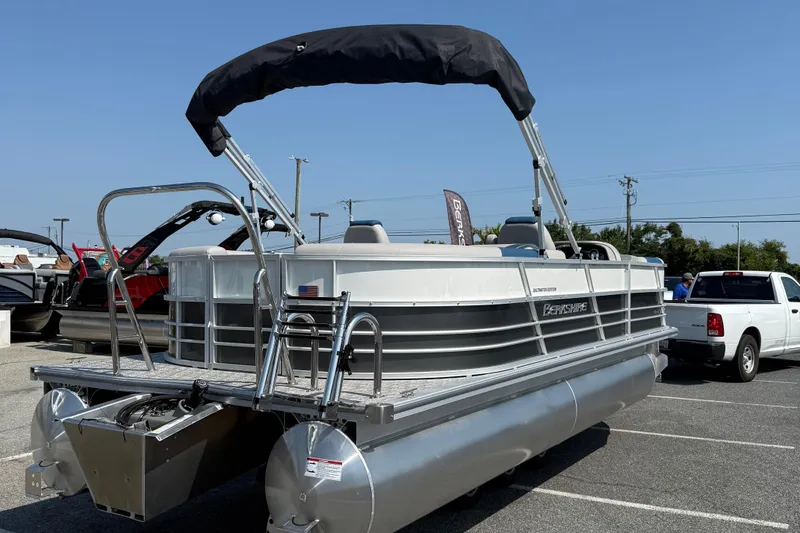 Slide: The Image of 2026 Berkshire 22RFX LE pontoon boat with canopy in a parking lot. - 8