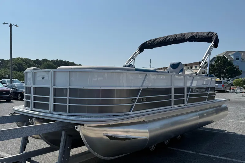 Slide: The Image of 2026 Berkshire 22RFX LE pontoon boat with canopy in parking lot. - 4