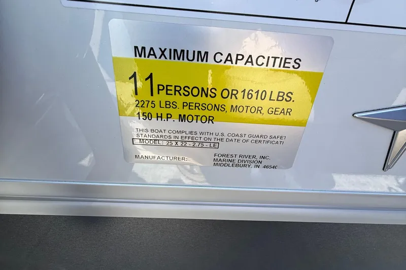 Slide: The Image of 2026 Berkshire 22RFX LE boat capacity label: 11 persons, 1610 lbs, 150 HP motor. - 16