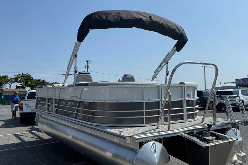 Slide: The Image of 2026 Berkshire 22RFX LE pontoon boat with canopy in parking lot. - 6