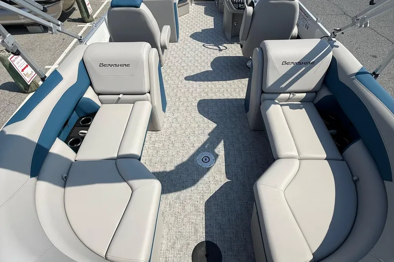 Slide: The Image of Luxurious interior of 2026 Berkshire 22RFX LE pontoon boat with plush seating and cup holders. - 11