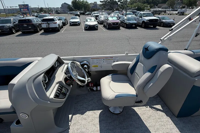 Slide: The Image of 2026 Berkshire 22RFX LE boat interior with steering wheel and captain's chair. - 12