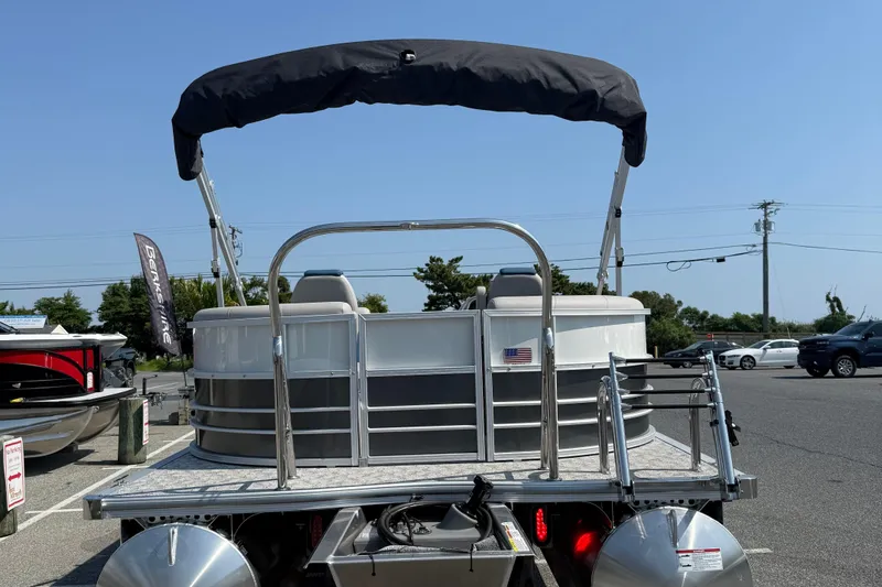 Slide: The Image of 2026 Berkshire 22RFX LE pontoon boat with canopy in parking lot. - 7