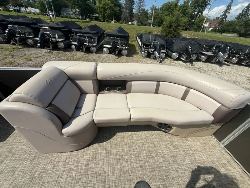 Slide: The Image of The image shows a beige seating area on a boat with carpeted flooring. - 7