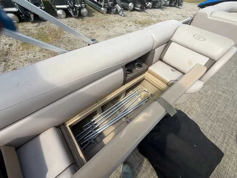 Slide: The Image of A seating area on a boat with storage underneath. - 23