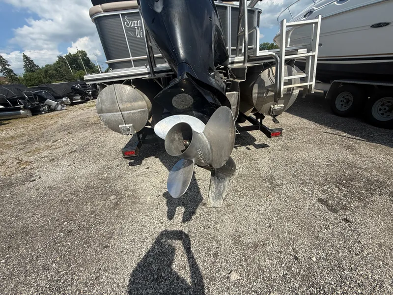Slide: The Image of Rear view of a 2018 Harris 240 CXCS Tritoon with visible propeller. - 4