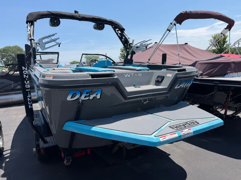 Slide: The Image of The image shows a 2021 Heyday WT-2DC boat in a parking lot. - 3