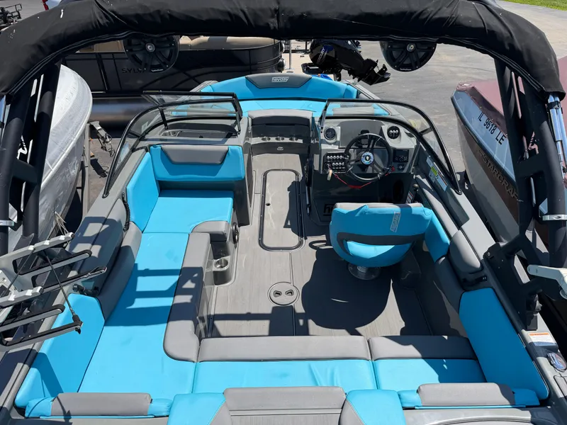 Slide: The Image of The image shows the interior of a 2021 Heyday WT-2DC boat with blue seating. - 23