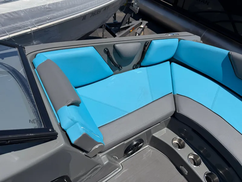 Slide: The Image of The image shows the interior of a 2021 Heyday WT-2DC boat with blue and gray seating. - 7