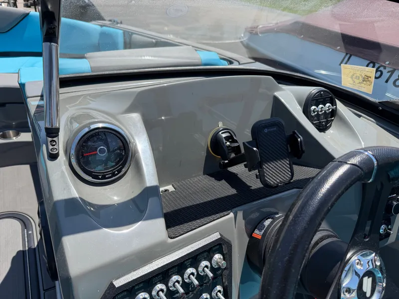 Slide: The Image of The dashboard of a 2021 Heyday WT-2DC boat with steering wheel and instruments. - 16