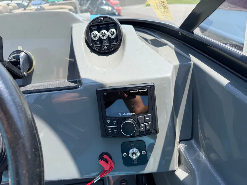 Slide: The Image of The image shows a boat dashboard with a control unit and speaker system. - 14