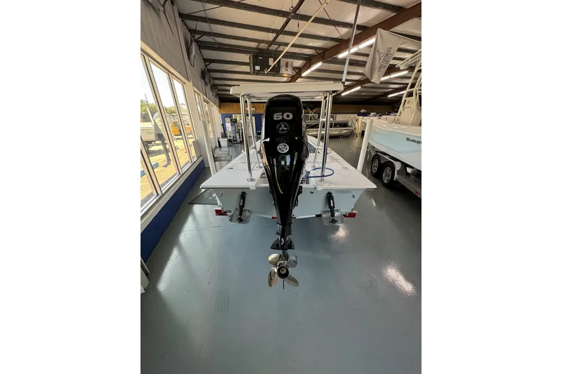 Slide: The Image of 2026 Mitzi Skiffs 17 Tournament boat with 60 HP engine in showroom. - 10