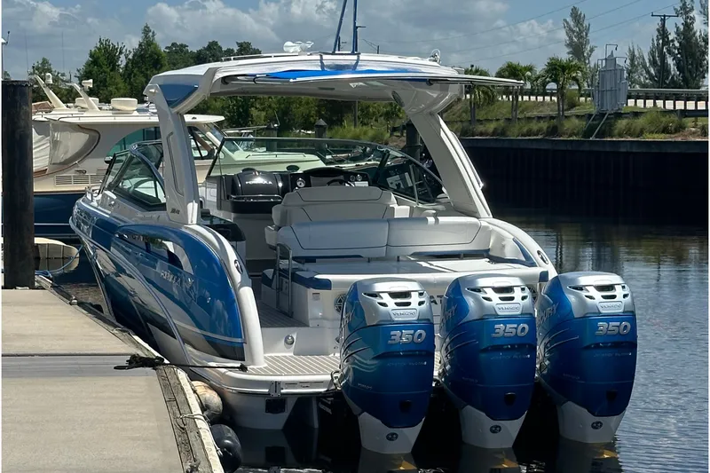 Slide: The Image of 2018 Formula 350 Crossover Bowrider OB with triple Mercury 350 engines docked. - 7