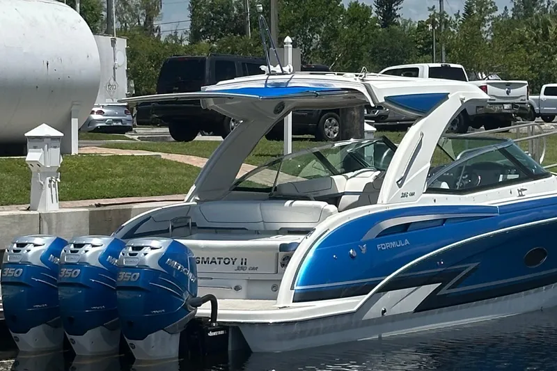 Slide: The Image of 2018 Formula 350 Crossover Bowrider OB with triple Mercury outboard engines docked. - 3