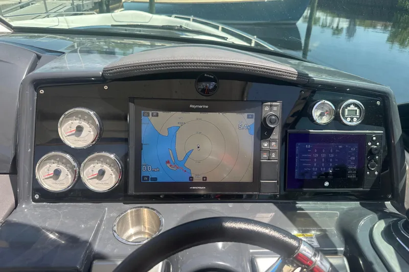 Slide: The Image of Dashboard of a 2018 Formula 350 Crossover Bowrider OB with navigation and gauges. - 14