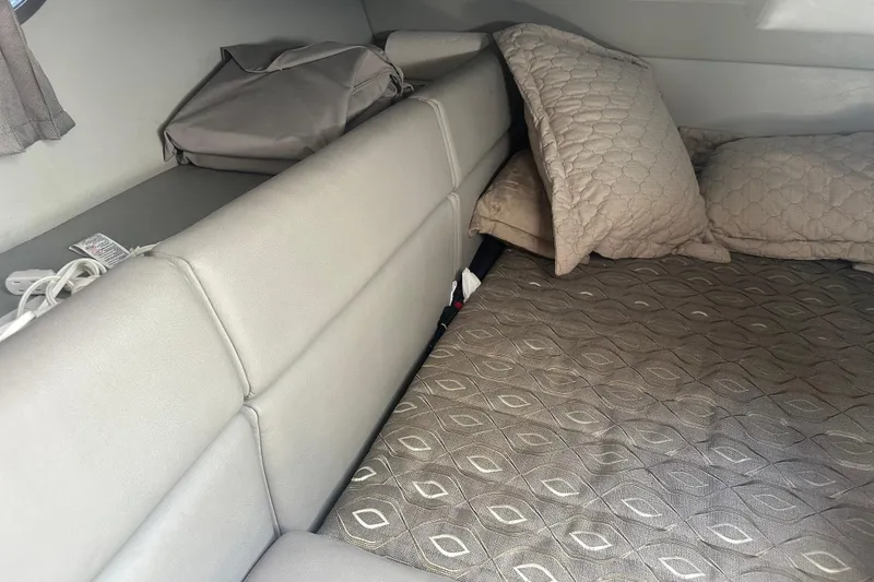 Slide: The Image of 2018 Formula 350 Crossover Bowrider OB cabin interior with cushions and bedding. - 37