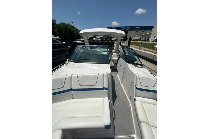 Slide: The Image of 2018 Formula 350 Crossover Bowrider OB, sleek design, spacious seating, docked under clear sky. - 15