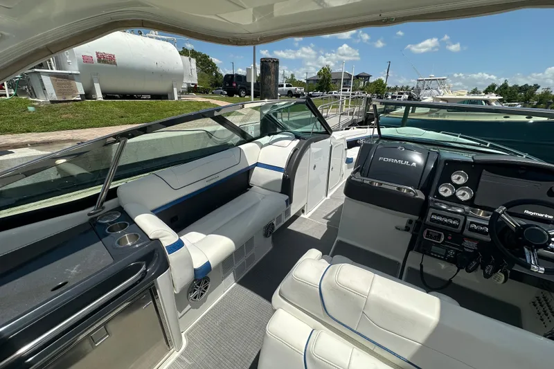 Slide: The Image of 2018 Formula 350 Crossover Bowrider OB interior with sleek dashboard and comfortable seating. - 29