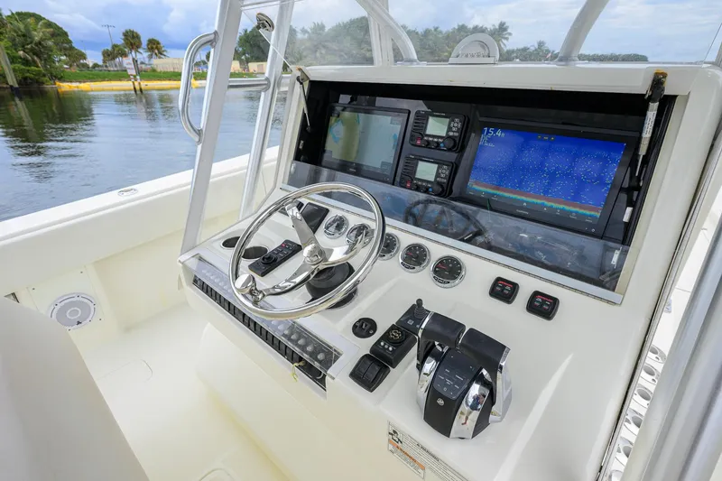 Slide: The Image of 2016 SeaVee 390Z boat helm with advanced navigation and control systems. - 47