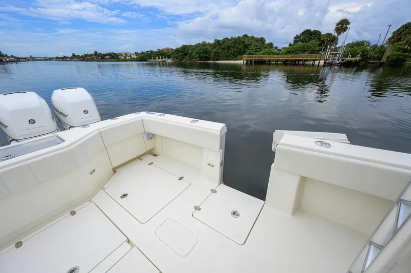 Slide: The Image of 2016 SeaVee 390Z boat with twin Mercury engines on a calm waterway. - 32