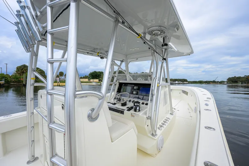 Slide: The Image of 2016 SeaVee 390Z boat interior with helm, ladder, and water view. - 49