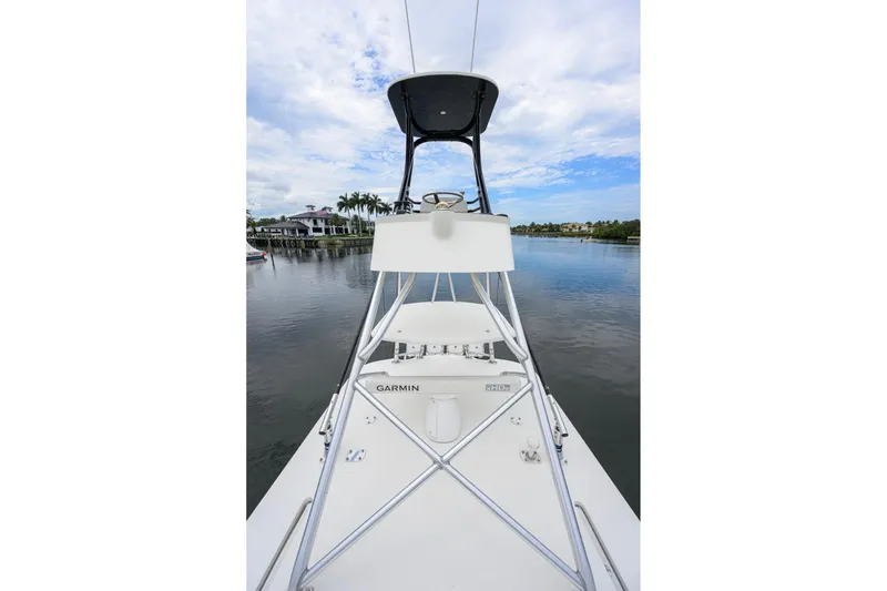 Slide: The Image of 2016 SeaVee 390Z boat with Garmin equipment on calm water, clear sky background. - 54