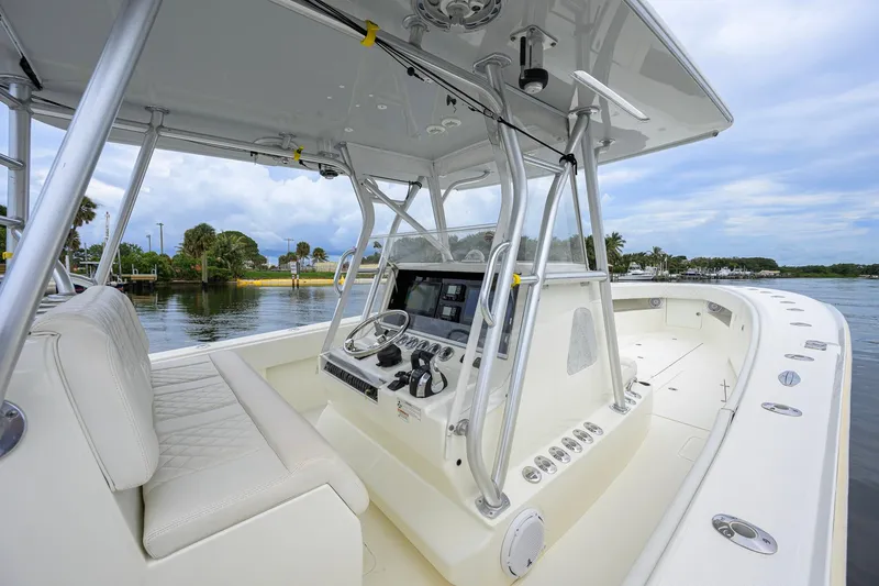 Slide: The Image of 2016 SeaVee 390Z boat interior with helm, steering wheel, and navigation equipment. - 48