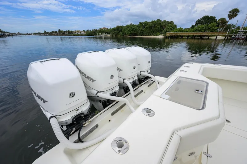 Slide: The Image of 2016 SeaVee 390Z boat with four Mercury outboard engines on a calm waterway. - 42