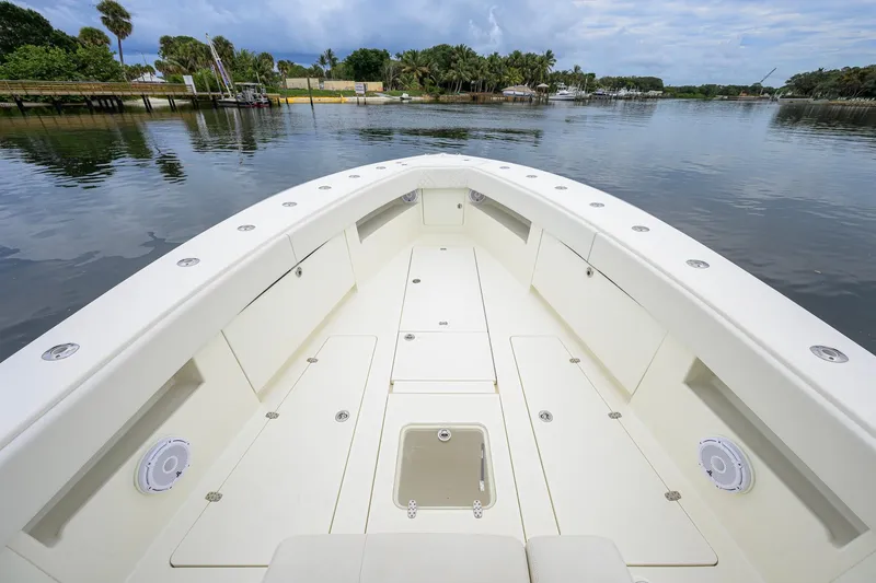 Slide: The Image of 2016 SeaVee 390Z boat deck with storage compartments on calm water. - 7