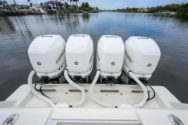 Slide: The Image of 2016 SeaVee 390Z boat with four Mercury outboard engines on a calm waterway. - 41