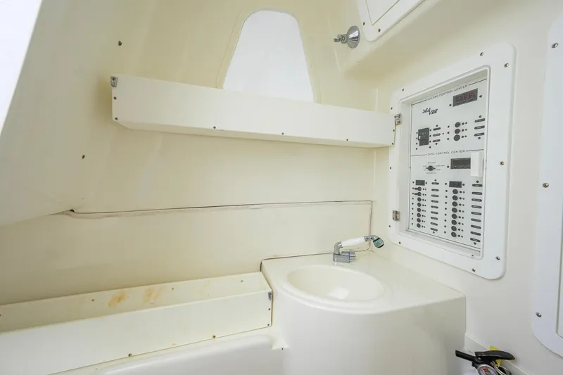 Slide: The Image of 2016 SeaVee 390Z boat interior with control panel and sink. - 37
