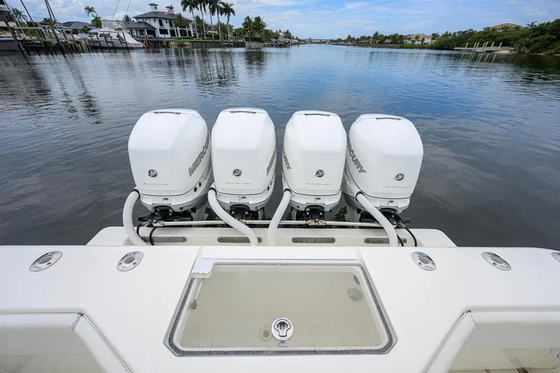 Slide: The Image of 2016 SeaVee 390Z boat with four Mercury outboard engines on a calm waterway. - 40