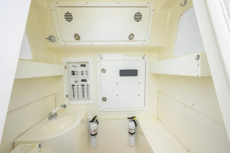 Slide: The Image of Interior of 2016 SeaVee 390Z boat featuring control panel and safety equipment. - 36
